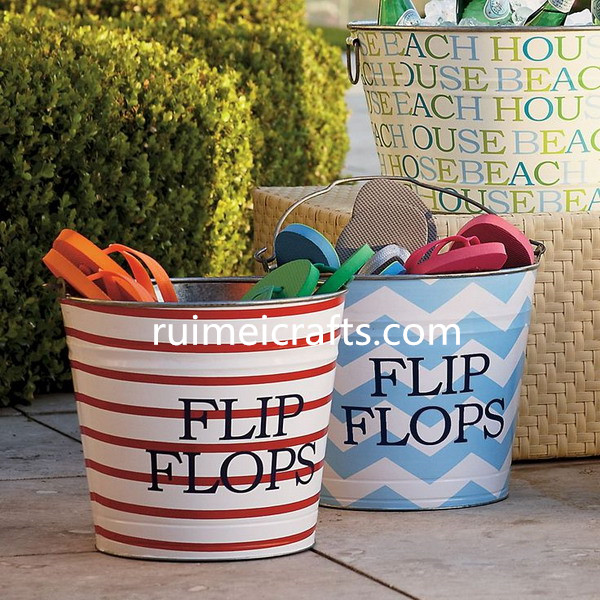 painted decorative backyard metal bucket for flip flops.jpg